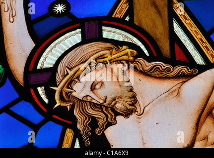 Christ`s crucifixion stained glass, St. John the Baptist Church, Upper Boddington, Northamptonshire, England, UK Stock Photo